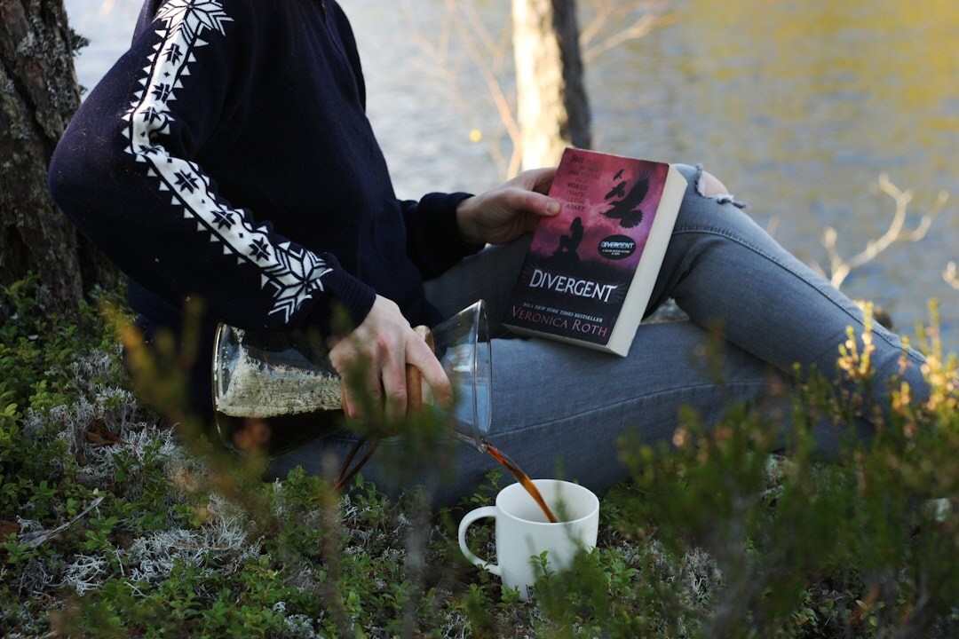 person reading thriller book